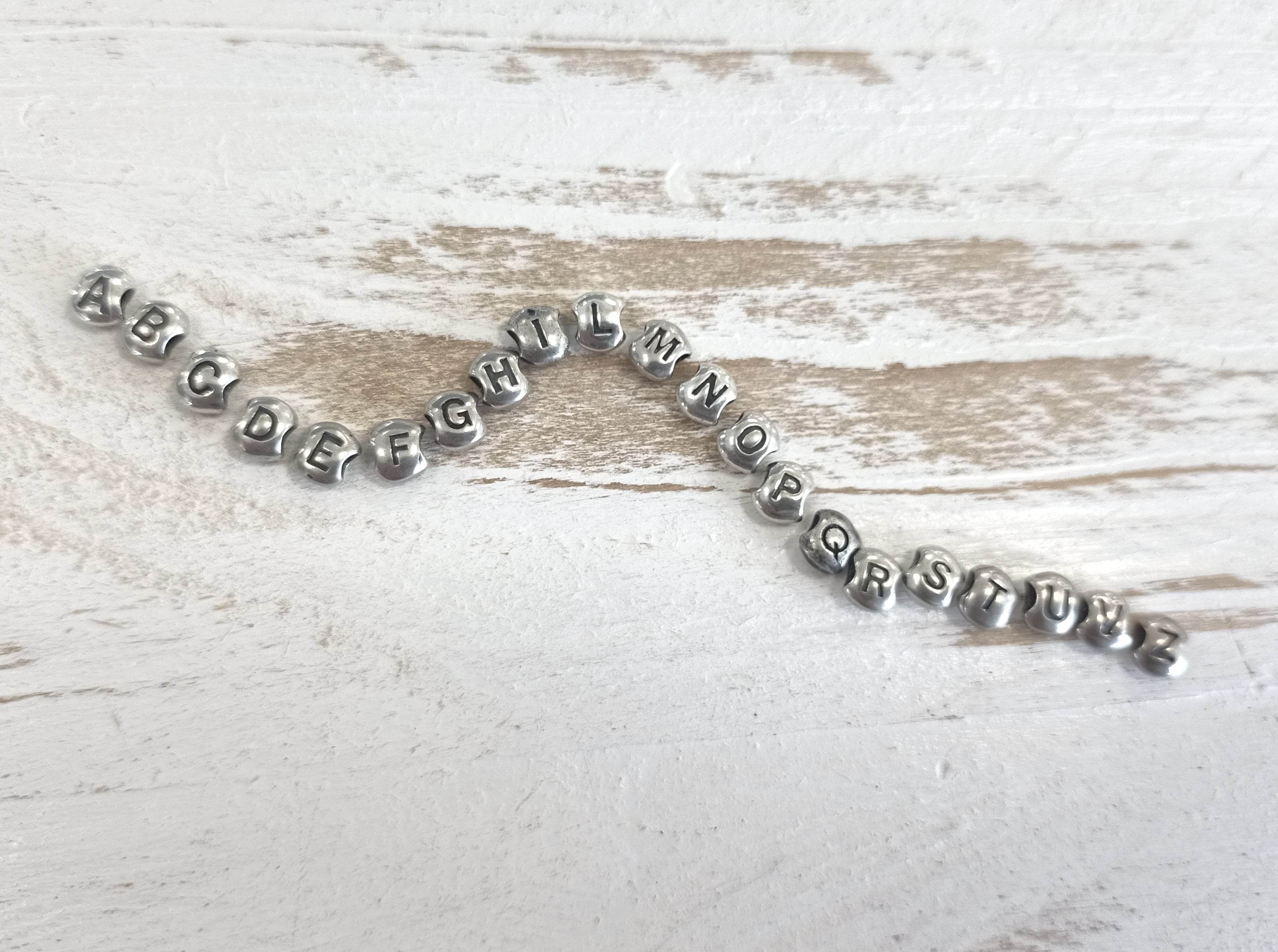 Anello elastico letterina - SPAN36 - Spadarella Gioielli